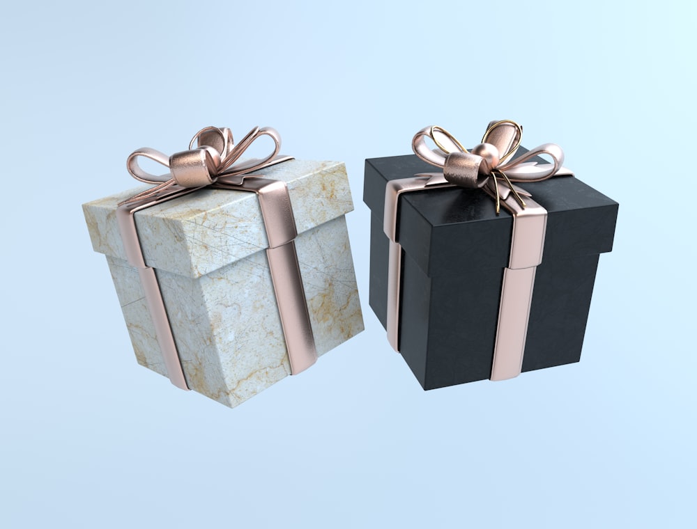 Two premium gift boxes with rose-gold ribbon bows